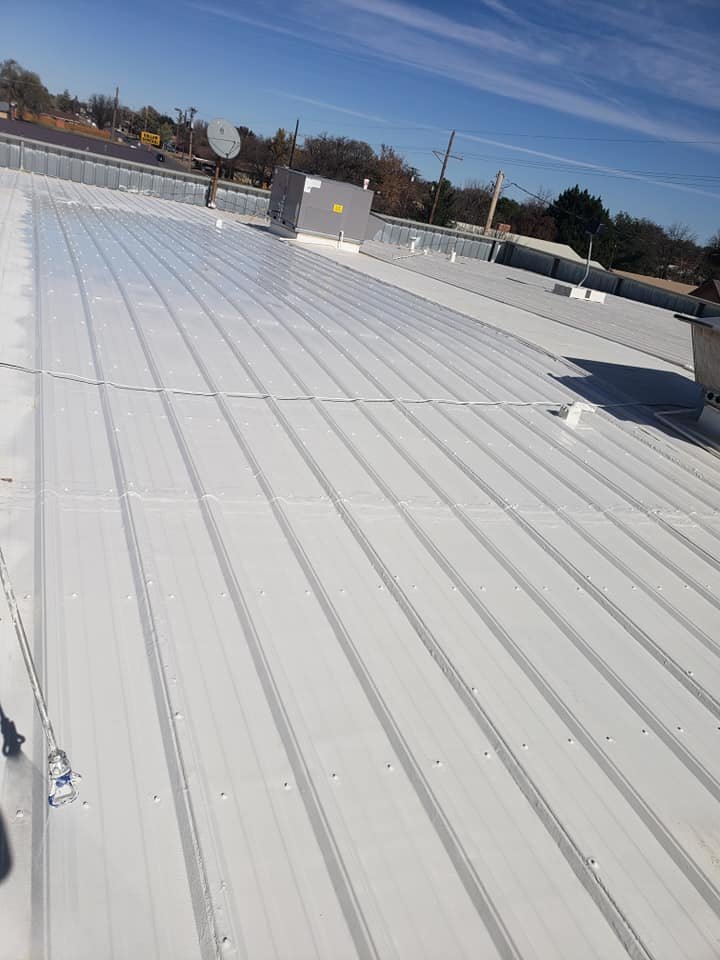 Spray foam coated corrugated metal commercial roof