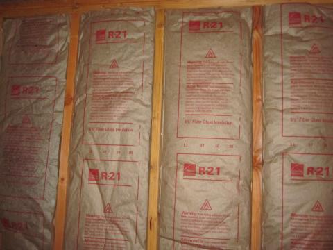 R-21 fiberglass batt insulation fitted between wall studs