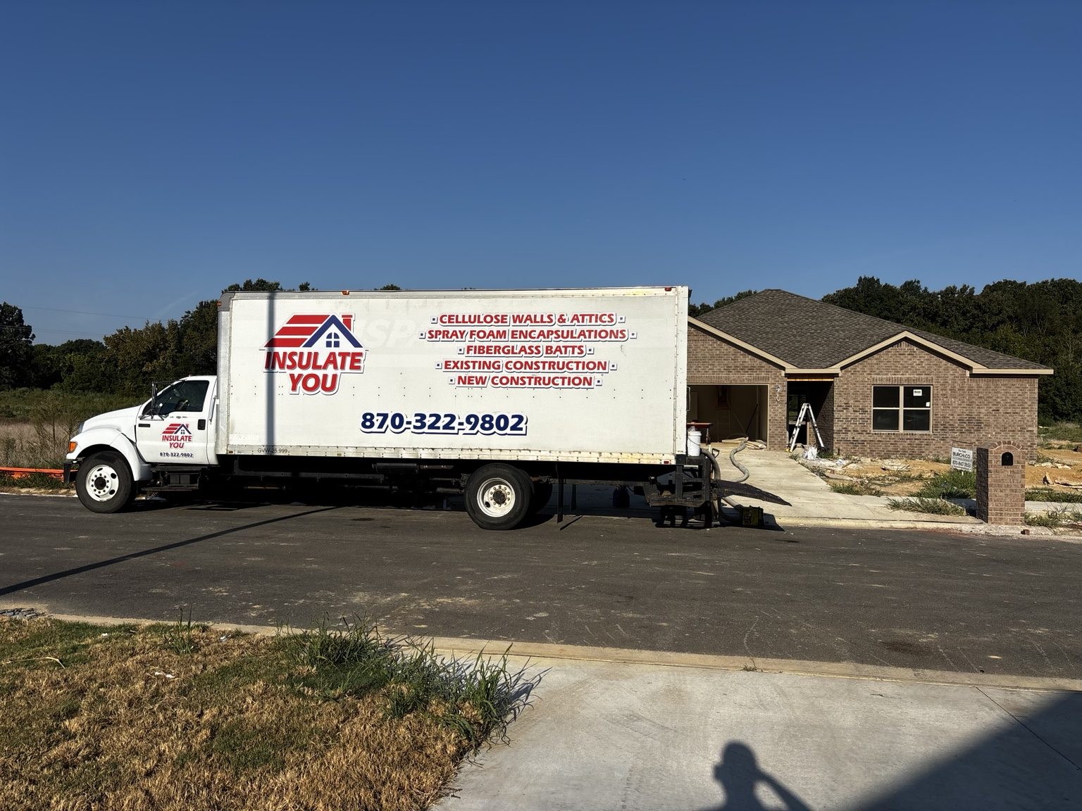 Insulate You crew truck at a Northeast Arkansas new construction insulation job